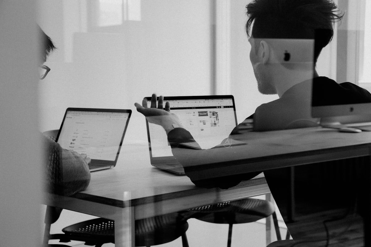 HR consultants reviewing policy documents in a meeting